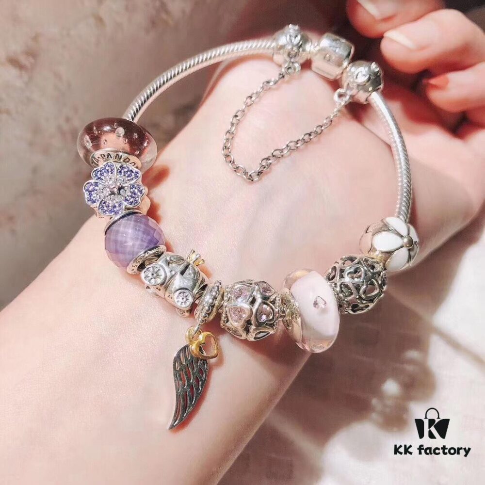692fe51d99f2d84055c8c1e5 Pandora Pink and Purple Two-Tone Angel Wings New Arrival! Crafted with authentic boutique materials, perfectly replicated to match retail quality. Features pink heart glass beads, purple and brown two-tone glass beads, pumpkin carriage charm, pink heart charm, openwork heart charm, purple five-petal flower charm, and angel wings pendant.