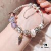 692fe51d99f2d84055c8c1e5 Pandora Pink and Purple Two-Tone Angel Wings New Arrival! Crafted with authentic boutique materials, perfectly replicated to match retail quality. Features pink heart glass beads, purple and brown two-tone glass beads, pumpkin carriage charm, pink heart charm, openwork heart charm, purple five-petal flower charm, and angel wings pendant.