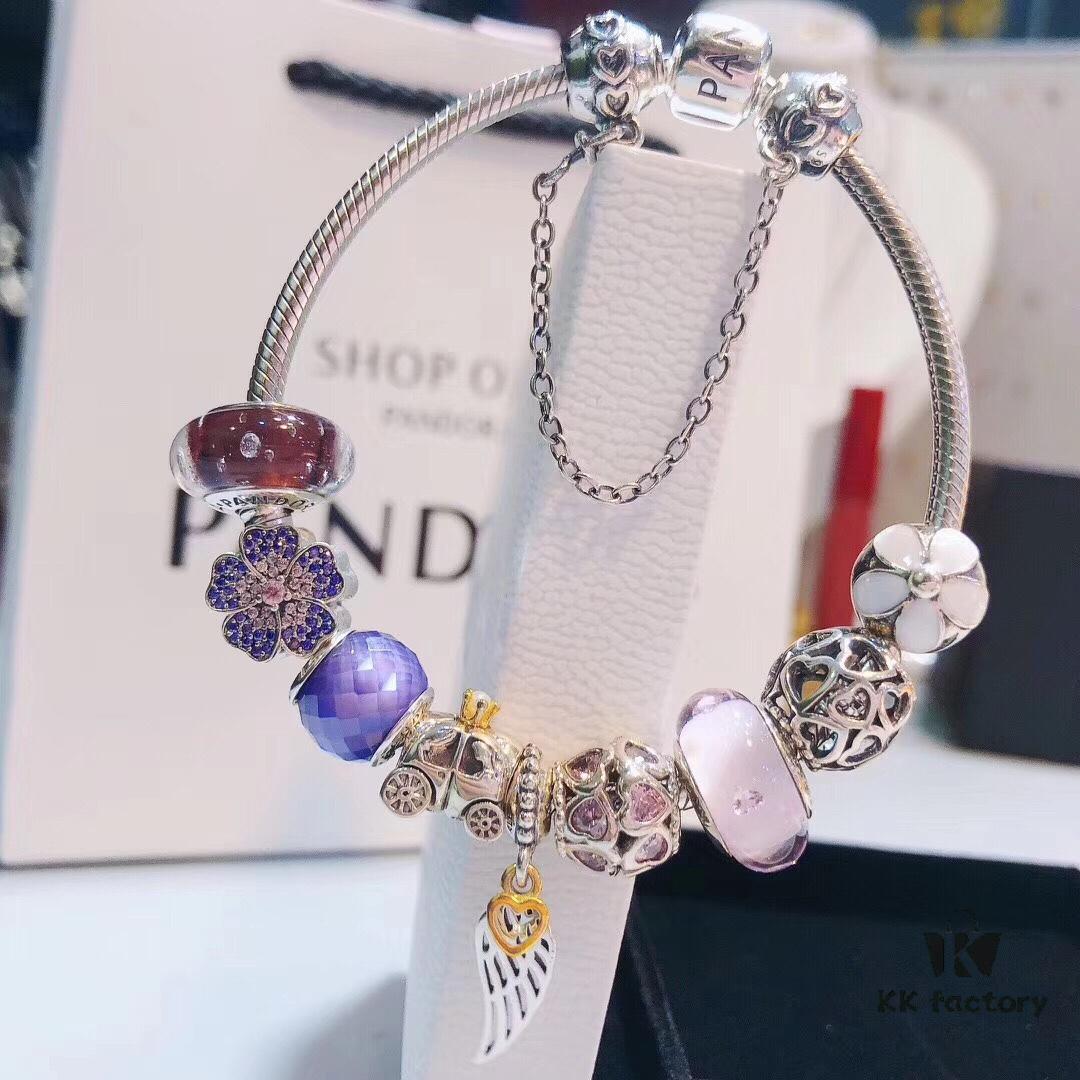 692fe51d99f2d84055c8c1e7 Pandora Pink and Purple Two-Tone Angel Wings New Arrival! Crafted with authentic boutique materials, perfectly replicated to match retail quality. Features pink heart glass beads, purple and brown two-tone glass beads, pumpkin carriage charm, pink heart charm, openwork heart charm, purple five-petal flower charm, and angel wings pendant.
