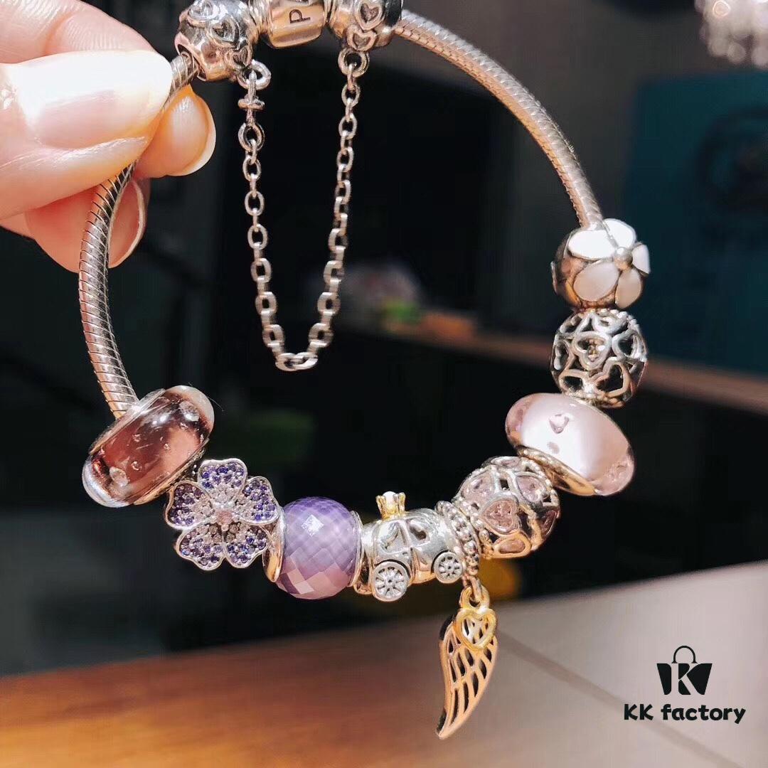 692fe51d99f2d84055c8c1e8 Pandora Pink and Purple Two-Tone Angel Wings New Arrival! Crafted with authentic boutique materials, perfectly replicated to match retail quality. Features pink heart glass beads, purple and brown two-tone glass beads, pumpkin carriage charm, pink heart charm, openwork heart charm, purple five-petal flower charm, and angel wings pendant.