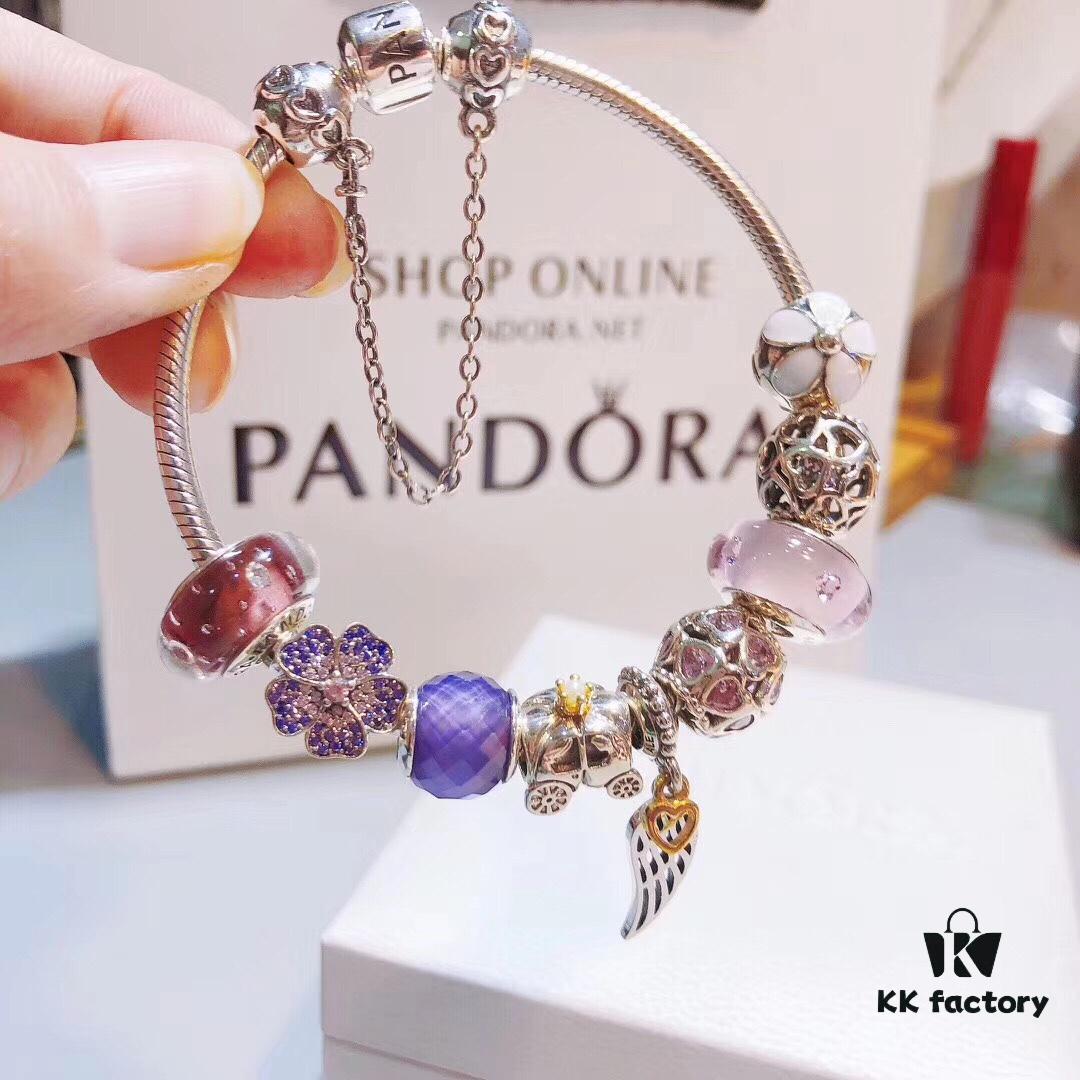 692fe51e99f2d84055c8c1e9 Pandora Pink and Purple Two-Tone Angel Wings New Arrival! Crafted with authentic boutique materials, perfectly replicated to match retail quality. Features pink heart glass beads, purple and brown two-tone glass beads, pumpkin carriage charm, pink heart charm, openwork heart charm, purple five-petal flower charm, and angel wings pendant.