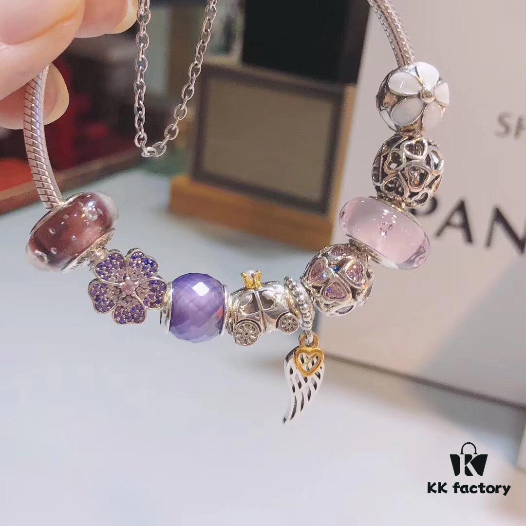 692fe51e99f2d84055c8c1ea Pandora Pink and Purple Two-Tone Angel Wings New Arrival! Crafted with authentic boutique materials, perfectly replicated to match retail quality. Features pink heart glass beads, purple and brown two-tone glass beads, pumpkin carriage charm, pink heart charm, openwork heart charm, purple five-petal flower charm, and angel wings pendant.