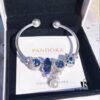 692fe58899f2d84055c8c2ae Pandora Blue Pearl Bow Knot Bracelet - New Arrival with Sparkling Blue Faceted Glass and Black Opal Cat's Eye