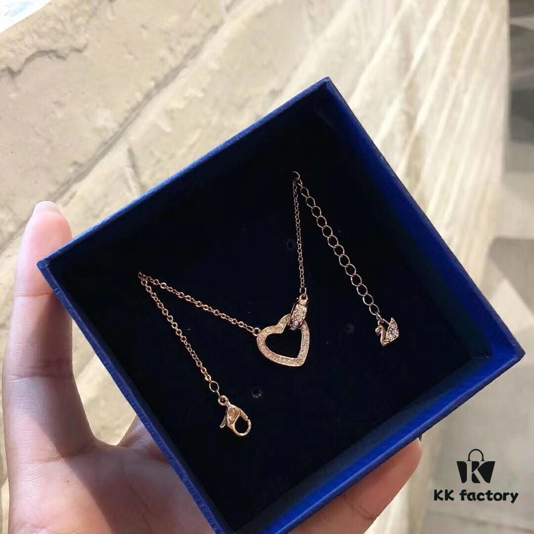 692fe66699f2d84055c8c435 Swarovski 2018 Lovely Romantic Heart Necklace for Women, Gift for Girlfriend, Elegant and Fresh Design with Knot-Shaped Heart Symbolizing a Unique Bond, Sparkling Golden-Tone Plating with Transparent Pavé Crystals, Perfect for Daily Wear and an Ideal Gift of Love