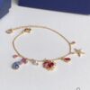692fe68599f2d84055c8c475 Swarovski OCEAN Marine Life Bicolor Colorful Bracelet for Women, Golden Chain with Gradient Seahorse, Crab Charm and Starfish Detail, Adjustable Fit, Perfect Gift for Her