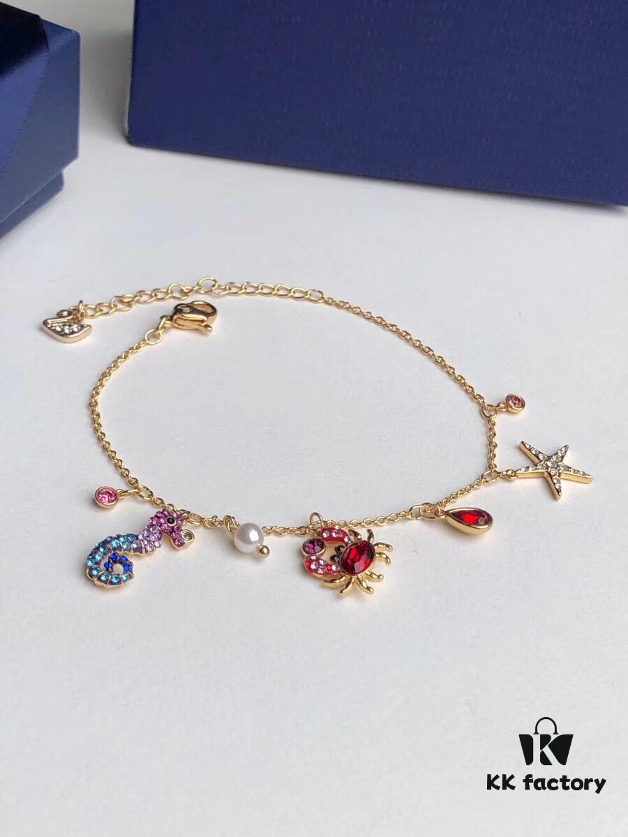 692fe68599f2d84055c8c475 Swarovski OCEAN Marine Life Bicolor Colorful Bracelet for Women, Golden Chain with Gradient Seahorse, Crab Charm and Starfish Detail, Adjustable Fit, Perfect Gift for Her