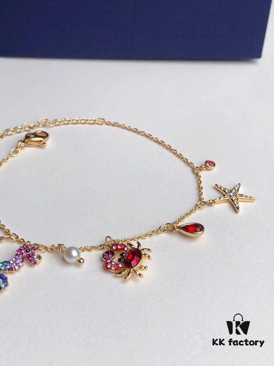 692fe68899f2d84055c8c479 Swarovski OCEAN Marine Life Bicolor Colorful Bracelet for Women, Golden Chain with Gradient Seahorse, Crab Charm and Starfish Detail, Adjustable Fit, Perfect Gift for Her