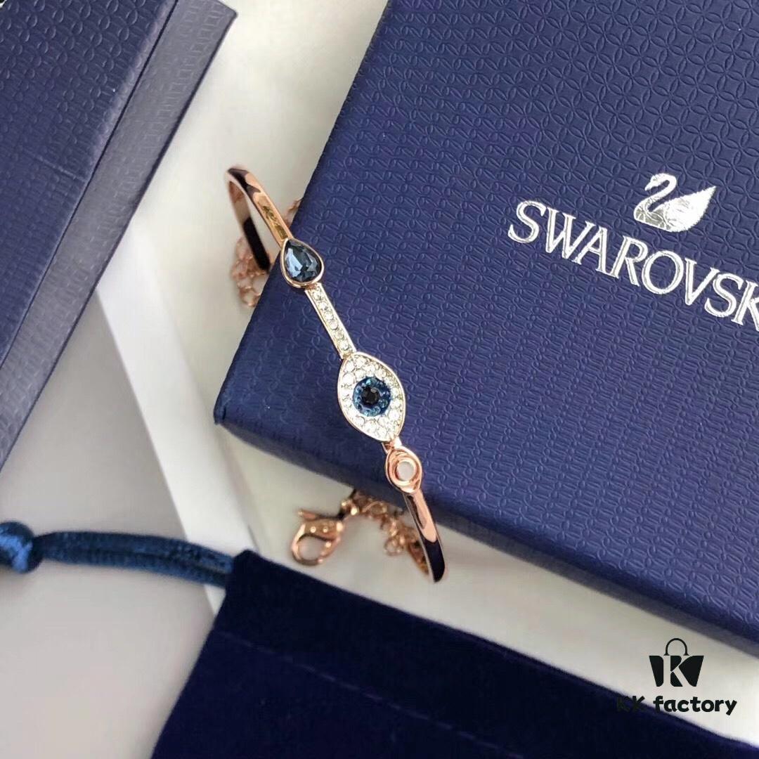 692fe6b099f2d84055c8c4ba Swarovski Demon Bracelet, Classic Best-Selling Design with Black, Blue, and White Crystals Encircling Gracefully, Evoking the Mystical Potion of the Demon's Eye That Opens the Door to Luck and Lifelong Blessings! Elegant 18K Rose Gold-Plated Alloy with Vacuum Plating Paired with Black, Blue, and White Swarovski Crystals. One Size Fits All with Full Original Retail Packaging!