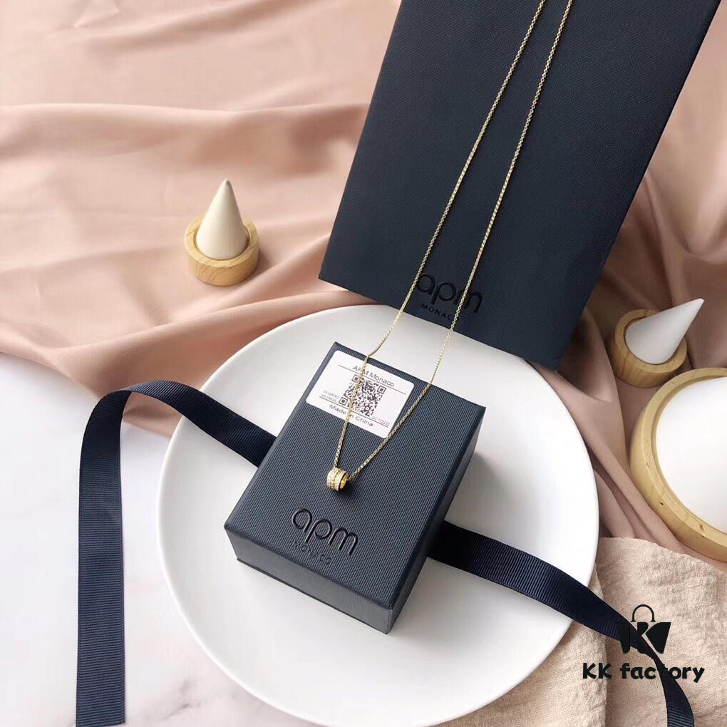 692fe7a799f2d84055c8c660 APM Monaco Silver-Plated Gold-Tone Necklace with Crystal Pendant for Women, Elegant Circular Locket Chain
