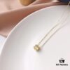 692fe7a799f2d84055c8c663 APM Monaco Silver-Plated Gold-Tone Necklace with Crystal Pendant for Women, Elegant Circular Locket Chain