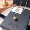 692fe7aa99f2d84055c8c665 APM Monaco Silver-Plated Gold-Tone Necklace with Crystal Pendant for Women, Elegant Circular Locket Chain