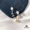 692fe7ca99f2d84055c8c69c APM Monaco Asymmetrical Petal with Freshwater Pearl Earrings, Designer Silver Drop Earrings for Women