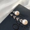 692fe7cb99f2d84055c8c69d APM Monaco Asymmetrical Petal with Freshwater Pearl Earrings, Designer Silver Drop Earrings for Women