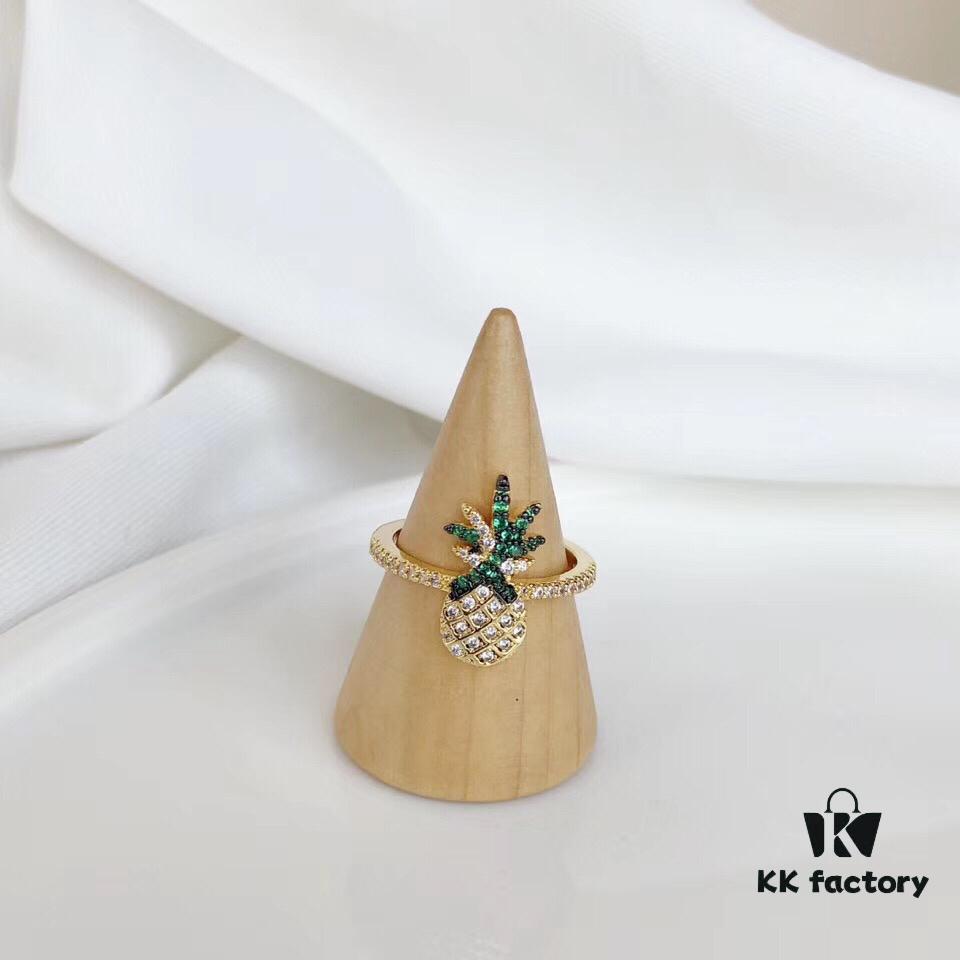 692fe7e699f2d84055c8c6ca APM Monaco Pineapple Ring! Sparkling colorful crystals paired with various summer-inspired fruits and elements, creating a playful melody that adds a refreshing touch to your summer