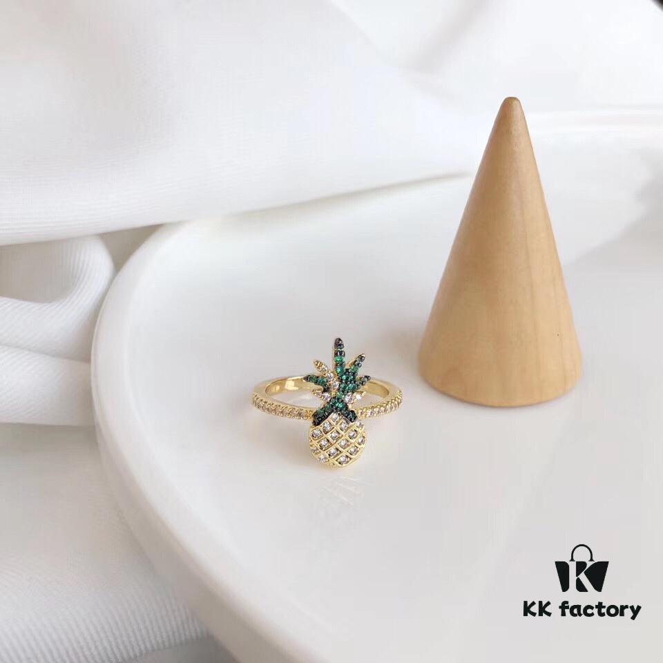 692fe7e799f2d84055c8c6cc APM Monaco Pineapple Ring! Sparkling colorful crystals paired with various summer-inspired fruits and elements, creating a playful melody that adds a refreshing touch to your summer