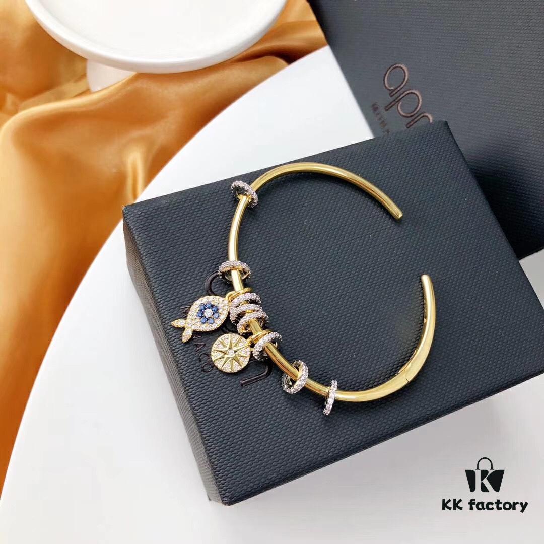 692fe9c199f2d84055c8c9fa APM Monaco Lucky Little Fish Bracelet with Sliding Ring in Gold-Tone, Stylish and Unique Open Cuff Bangle Jewelry in Silver