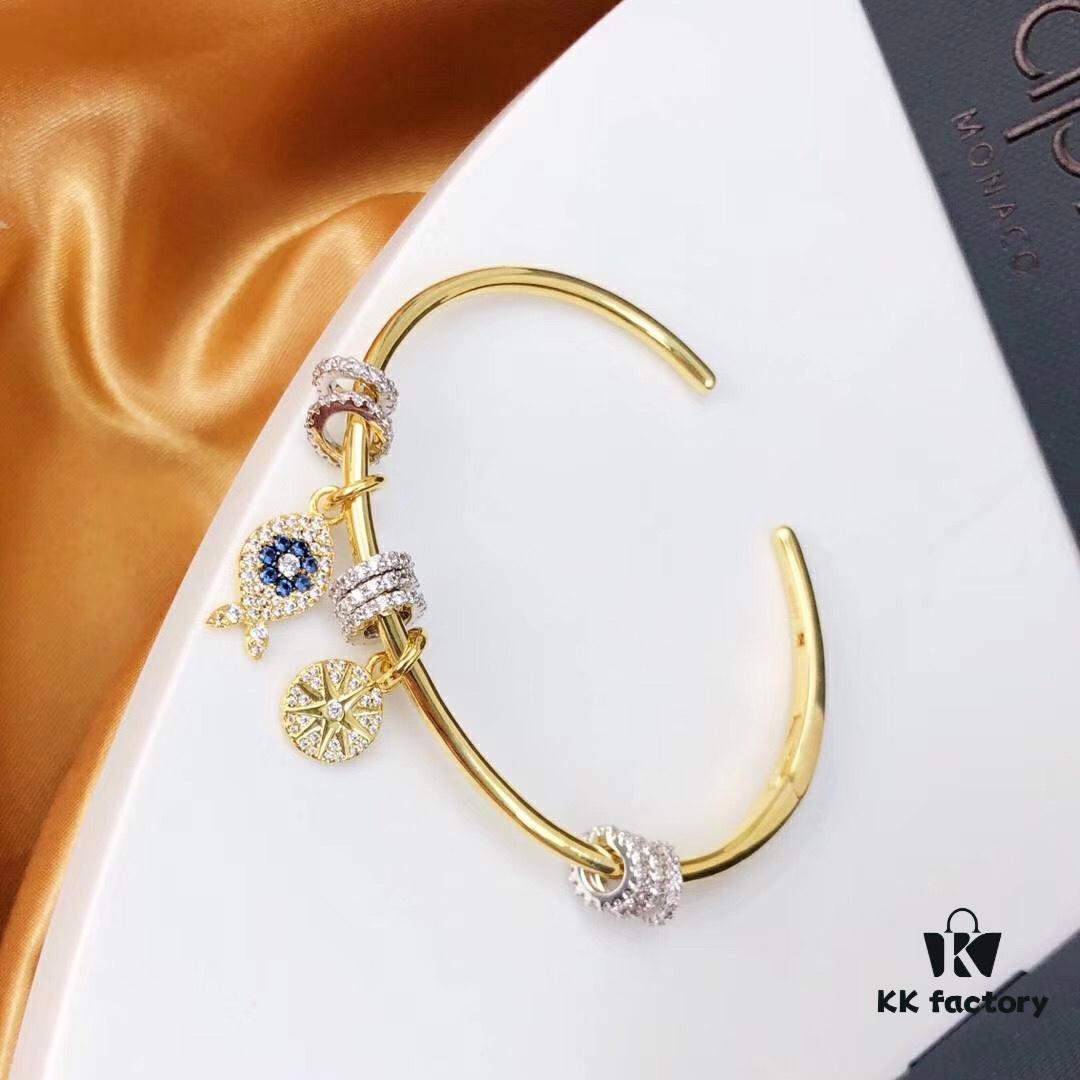 692fe9c299f2d84055c8c9fb APM Monaco Lucky Little Fish Bracelet with Sliding Ring in Gold-Tone, Stylish and Unique Open Cuff Bangle Jewelry in Silver