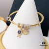 692fe9c599f2d84055c8c9ff APM Monaco Lucky Little Fish Bracelet with Sliding Ring in Gold-Tone, Stylish and Unique Open Cuff Bangle Jewelry in Silver