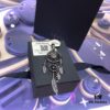 A Monaco Black and Gold Dreamcatcher Single Earring