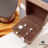 692fea2199f2d84055c8ca90 APM Monaco Mother-of-Pearl and Pearl Drop Earrings for Women, Asymmetric Luxury Jewelry, Elegant Long Dangle Earrings for Fall/Winter Events