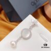692fea2299f2d84055c8ca92 APM Monaco Mother-of-Pearl and Pearl Drop Earrings for Women, Asymmetric Luxury Jewelry, Elegant Long Dangle Earrings for Fall/Winter Events