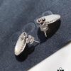 692fea2a99f2d84055c8ca9f APM Monaco Silver Crystal-Encrusted Mother-of-Pearl Earrings for Women, Delicate Petal Design, Elegant White Mother-of-Pearl Studs That Make You Radiant from Every Angle