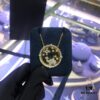 A Monaco Camel Round Pendant Necklace, Bracelet, Ring, and Earrings