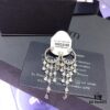 692feb7399f2d84055c8ccb6 APM Monaco Crystal-Encrusted Ringed Ruffle Necklace with Tassel Long Drop Earrings