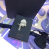 692febae99f2d84055c8cd16 APM Monaco Asymmetrical Cross Pearl Stud Earrings