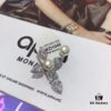 692febb299f2d84055c8cd1b APM Monaco Asymmetrical Cross Pearl Stud Earrings
