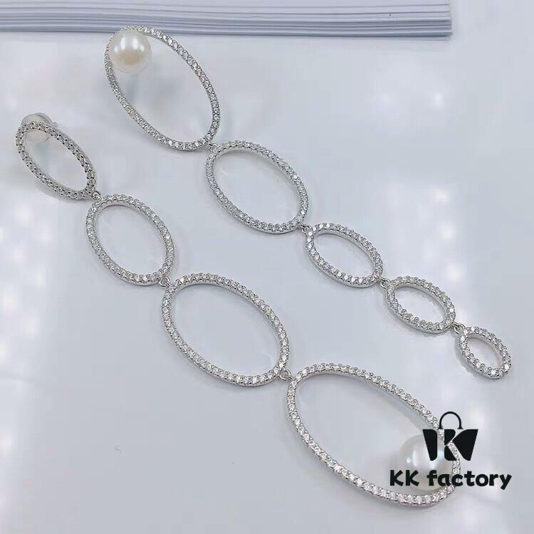 692febe699f2d84055c8cd6d APM Monaco Asymmetrical Interlocking Circle Pearl Long Tassel Earrings for Women