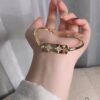 APM Monaco Gold-Tone Diamond-Paved Star Bracelet, New Arrival Unique Double Shooting Star Bangle