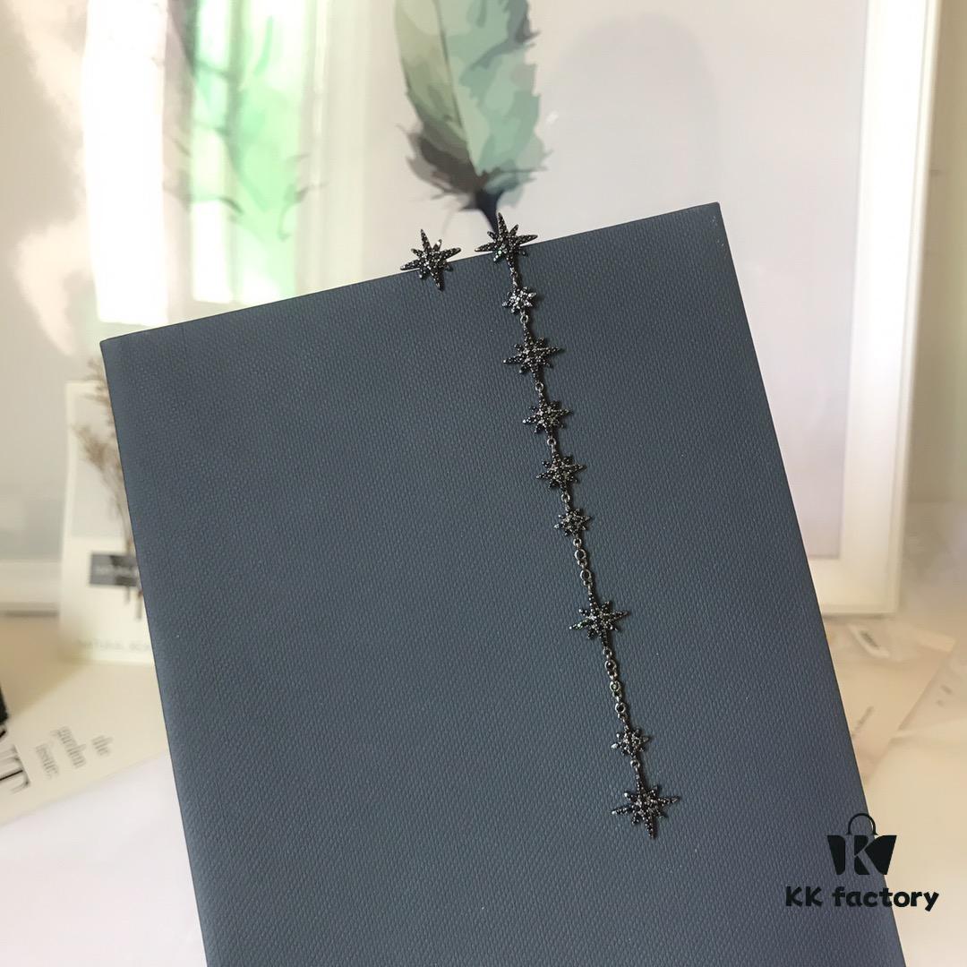 692feca799f2d84055c8cef9 APM Monaco Asymmetric Long Shooting Star Earrings, Stylish and Minimalist Design for Women