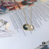 692fece399f2d84055c8cf72 APM Monaco Navy Enamel and White Mother-of-Pearl Necklace, Minimalist Retro Elegant High-End Pendant