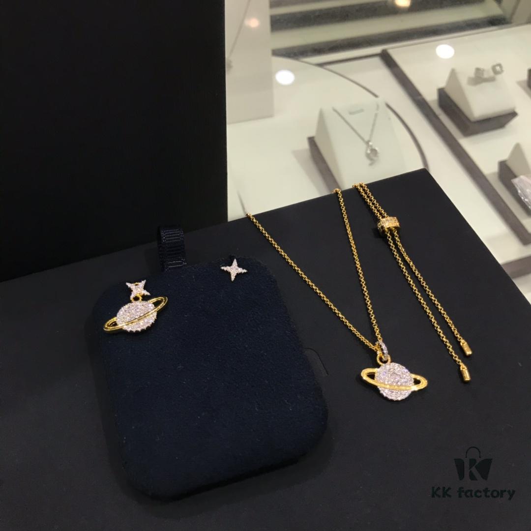 692fee0399f2d84055c8d1ad APM Monaco Cosmic Collection Saturn Planet Gold-Tone Stud Earrings and Necklace with Rhinestones, Stylish and Versatile