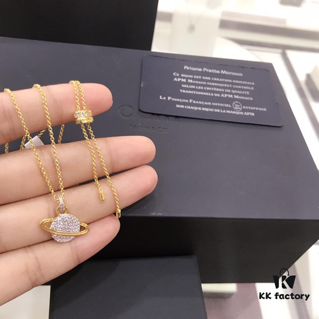 692fee0599f2d84055c8d1af APM Monaco Cosmic Collection Saturn Planet Gold-Tone Stud Earrings and Necklace with Rhinestones, Stylish and Versatile