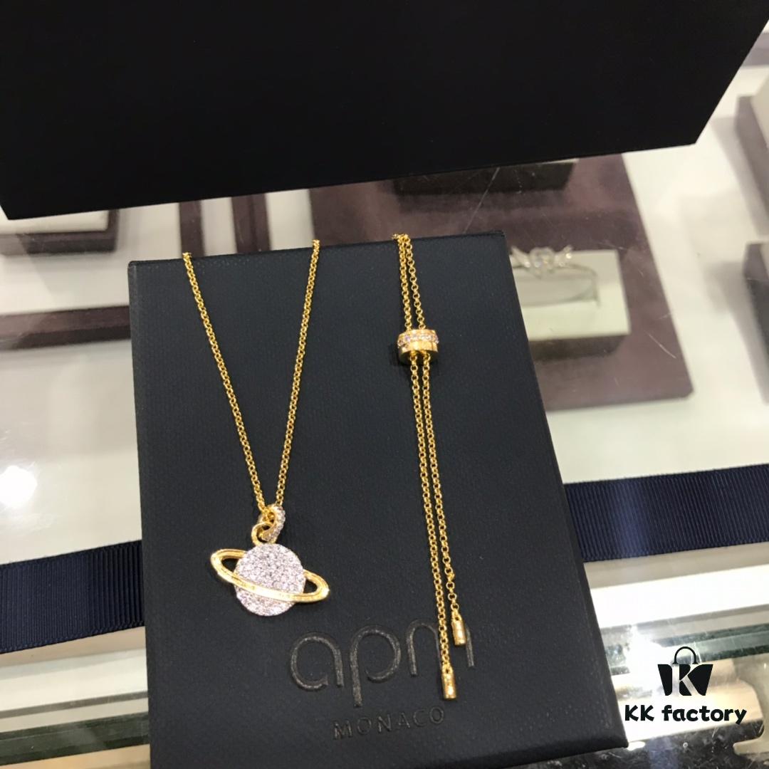 692fee0599f2d84055c8d1b0 APM Monaco Cosmic Collection Saturn Planet Gold-Tone Stud Earrings and Necklace with Rhinestones, Stylish and Versatile