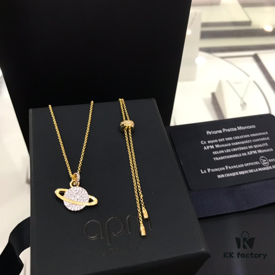 692fee0599f2d84055c8d1b1 APM Monaco Cosmic Collection Saturn Planet Gold-Tone Stud Earrings and Necklace with Rhinestones, Stylish and Versatile