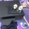 692fee1299f2d84055c8d1cb APM Monaco Stylish Crystal-Embedded Dragon Bone Ear Studs Y-Shaped Pendant Earrings for Women