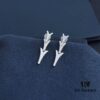 692fee2299f2d84055c8d1e2 APM Monaco Stylish Crystal-Embedded Dragon Bone Ear Studs Y-Shaped Pendant Earrings for Women