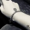 692feee899f2d84055c8d335 Gucci Tassel Double G Bracelet