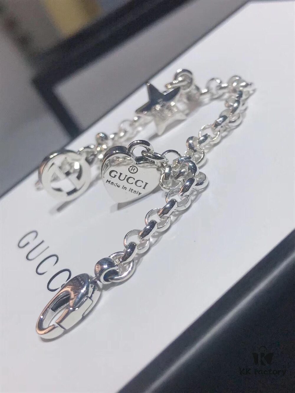 692feef199f2d84055c8d345 Gucci Tassel Double G Bracelet
