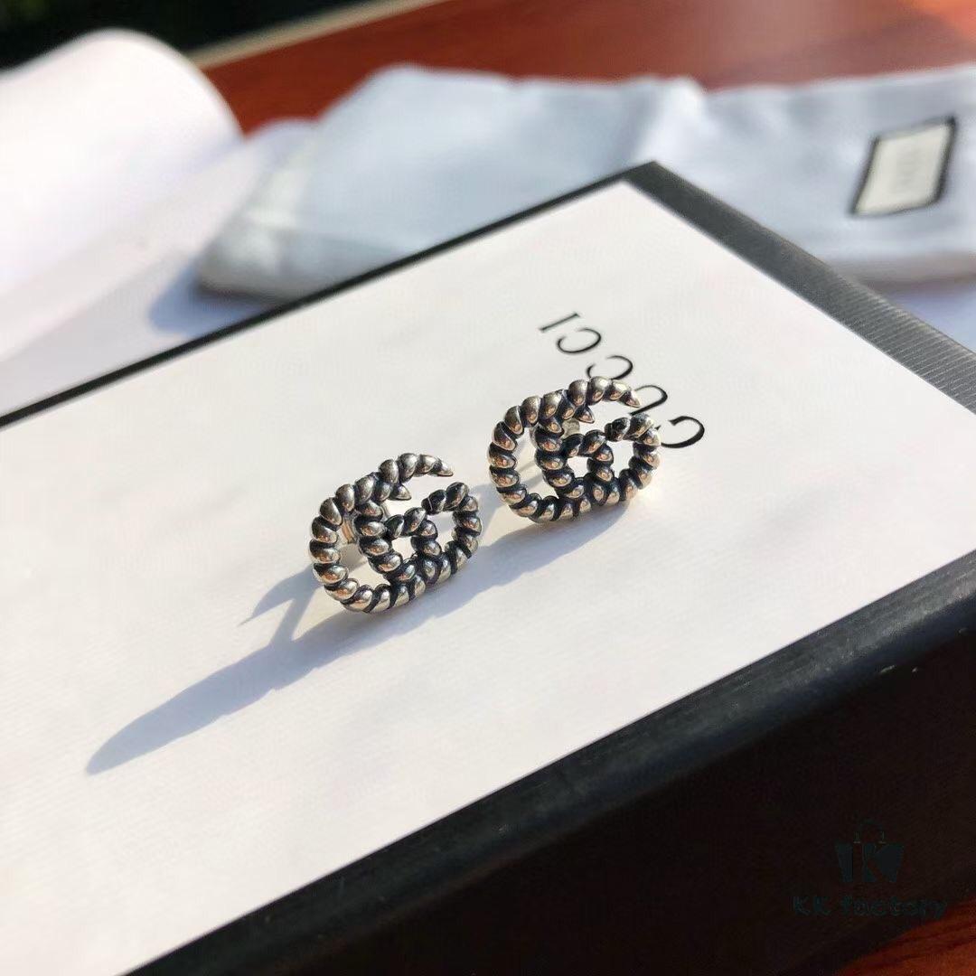 692fef0299f2d84055c8d362 New Arrival Sterling Silver Stud Earrings Featuring Interlocking GG Motif on Twisted Ribbon Design