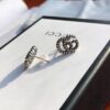 692fef0299f2d84055c8d363 New Arrival Sterling Silver Stud Earrings Featuring Interlocking GG Motif on Twisted Ribbon Design