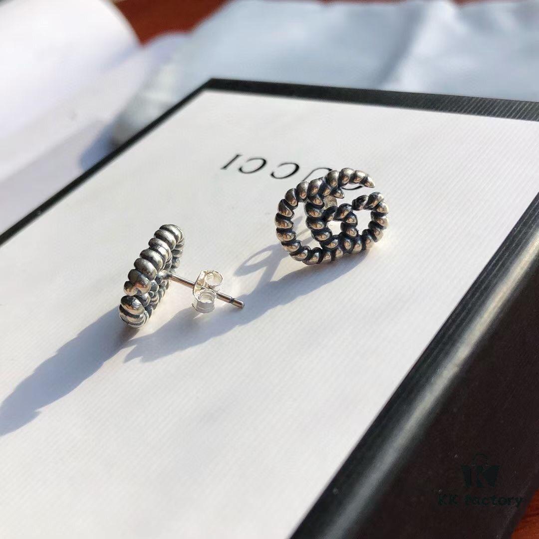 692fef0299f2d84055c8d363 New Arrival Sterling Silver Stud Earrings Featuring Interlocking GG Motif on Twisted Ribbon Design
