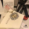 692fef5a99f2d84055c8d3f9 GUCCI Diamond-Accented Double G Sweater Chain