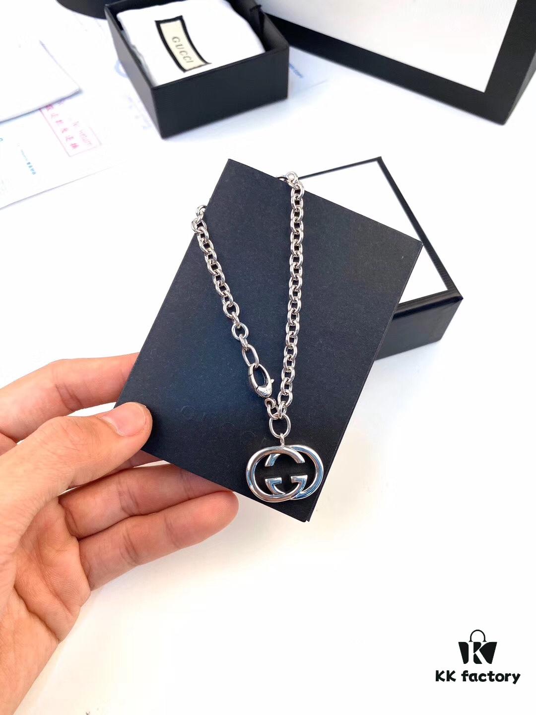 692fef9a99f2d84055c8d481 Gucci Bracelet with Interlocking Double G Pendant, Iconic Symbol of the Spirit, Crafted in Sterling Silver