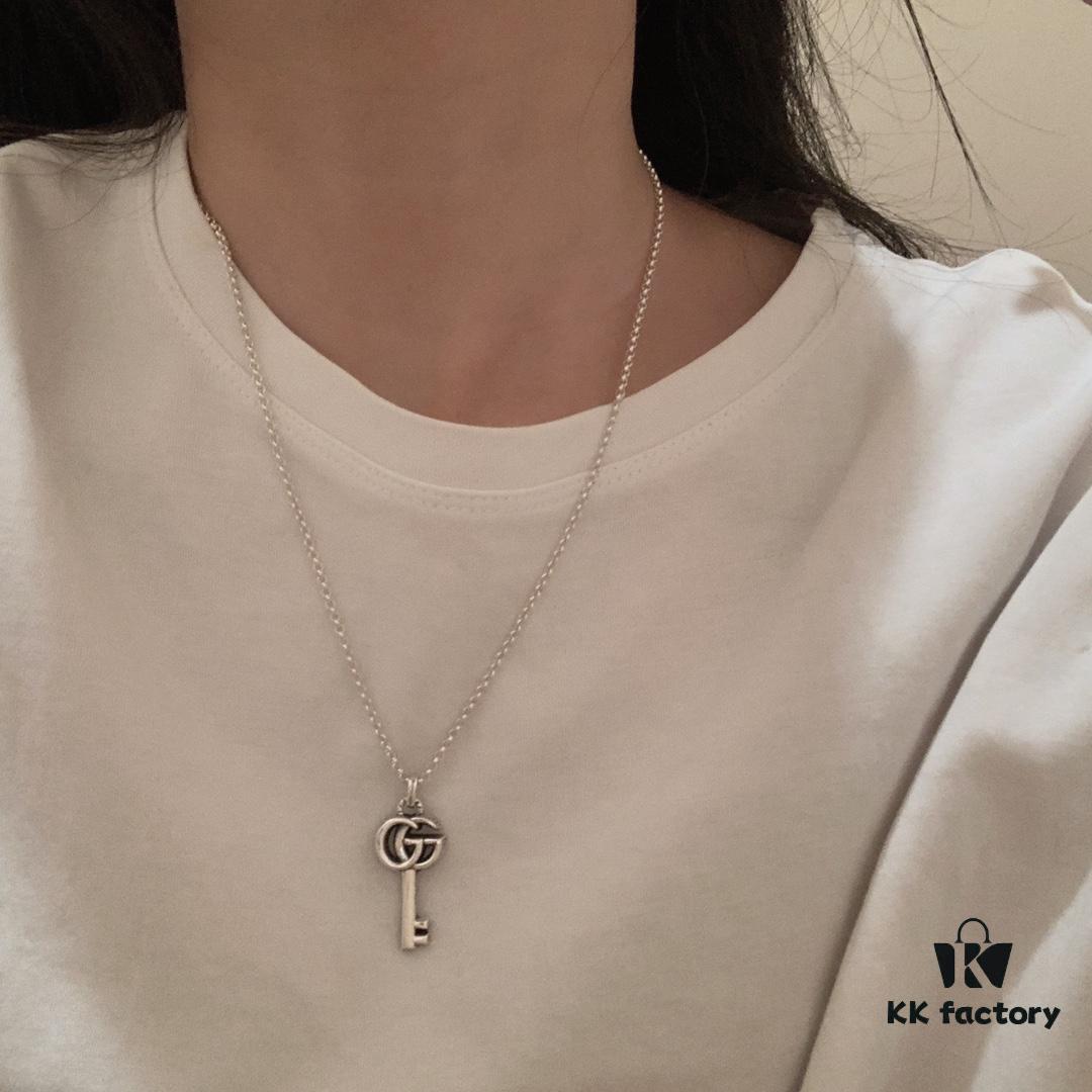 692ff14199f2d84055c8d786 Winter Essential — Gucci Key Necklace, Silver Pendant for Sweaters