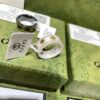 692ff1f699f2d84055c8d8cd GUCCI Overseas Member Gift - Gucci Gold-Trimmed Double G Ceramic Ring