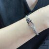 692ff49a99f2d84055c8dcf8 Fred Black and White Diamond Large Hoop Buckle Steel Rope Bracelet - Luxury Fashion Elegant Design, High-End Customized Thickened 18K Gold Plated Craftsmanship, Micro-Pave Workmanship, Must-Have Item for Influencers and Fashion Enthusiasts